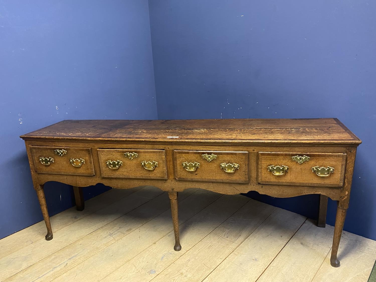 A good oak dresser base, with four drawers and brass handles, 216 x 51cm, some wear and old splits - Image 2 of 2