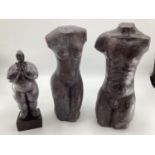 A C20th Spelter model of a naked lady on a cast square plinth together with two cast metal torso