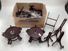 Collection of oriental hardwood stands, and lamp bases, and a quantity of plastic stands