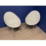 Pair of modern designer style , white and transparent plastic tub chairs, stamped Kartell to plastic