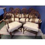 A good set of 12 (10+2 carvers) Chippendale style dining chairs with cream upholstery, 95cmH