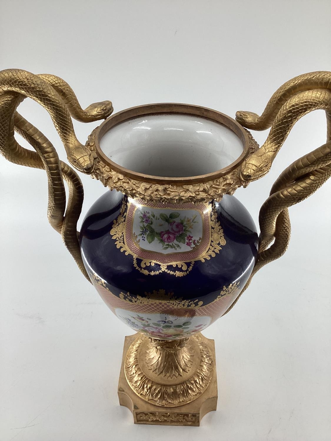 Meissen style lidded urn with gilt brass base and finial, gilt brass entwined snake handles, hand - Image 2 of 3