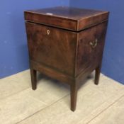 A mahogany square and fitted decanter box on raised legs, with brass handles to each side, as found