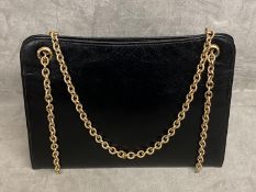 Cartier, a bespoke C20th leather handbag with 9ct gold mounts and yellow metal strap (relined by