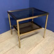 A brass and smoked glass two tier side table