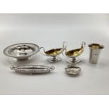 A collection of Sterling silver and white metal items to include a scallop shaped dish by