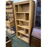 A modern heavy wooden bookshelf unit