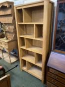 A modern heavy wooden bookshelf unit