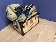 A wooden school tuck box and an Osprey rucksack
