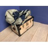 A wooden school tuck box and an Osprey rucksack