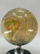 A mid century JRO globus, Munich, illuminated globe on turned ebonised stand, 38cmH