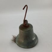 A vintage brass door bell on S hook