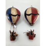 A pair of decorative papier Mache style hot air balloons, each 45cm H