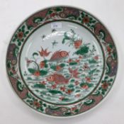 A RESTORED Chinese Famille Verte Charger, with six Character underglaze blue