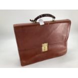 A vintage tan leather attache or brief case, 43 x 37cm