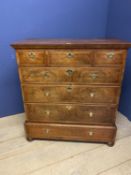 Mahogany & walnut chest of 3 short over 4 long graduated drawers on bun feet within a fitted