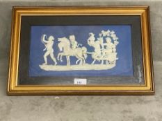 A Wedgwood Plaque, blue and white , in a gilt glazed frame, mounted, 27.5 x 42cm, as found see