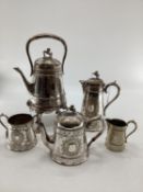 A silver plated five piece tea set with ornate decoration, Bacchus mask spouts engraved to jugs with