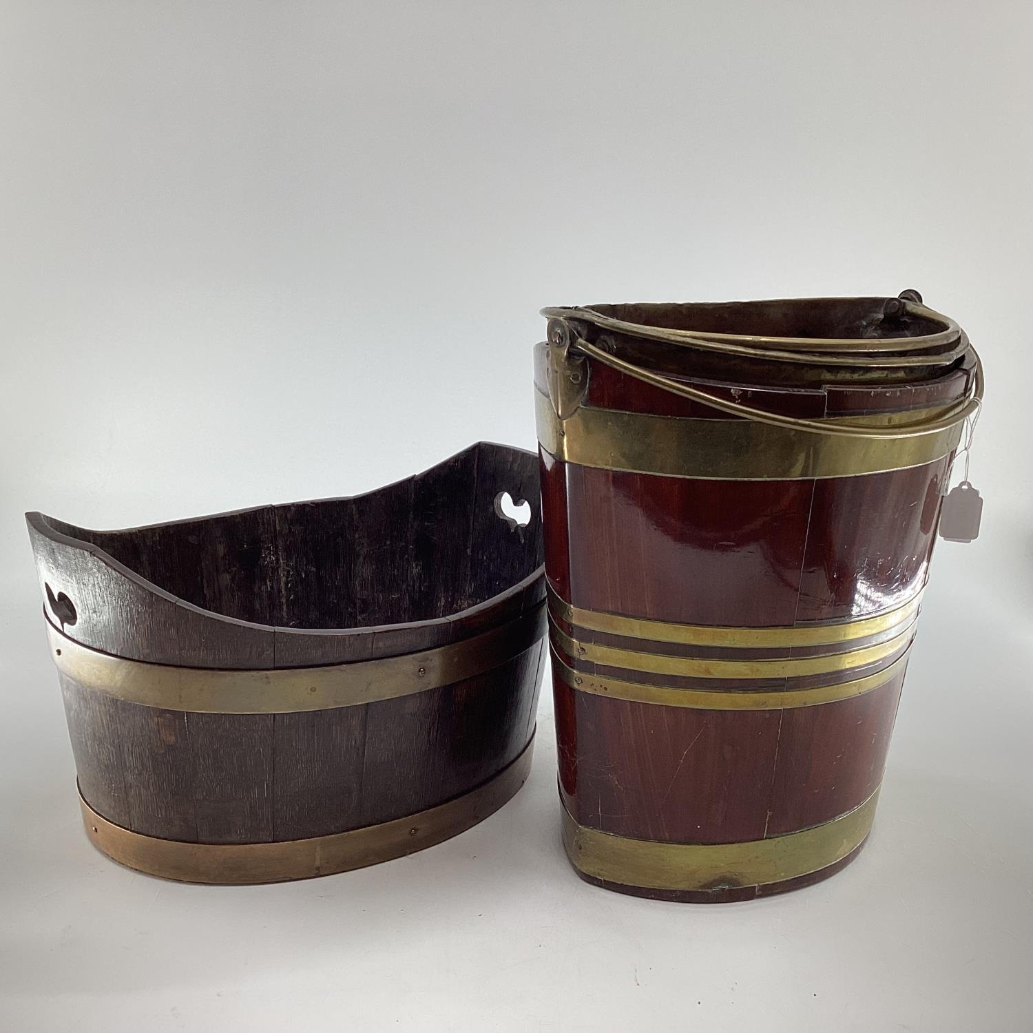 A mahogany and brass bound peat bucket with brass liner, together with an oak and brass example,