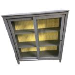 Modern grey painted sliding glazed door bookcase, and yellow patterned design to inside back 120cm W