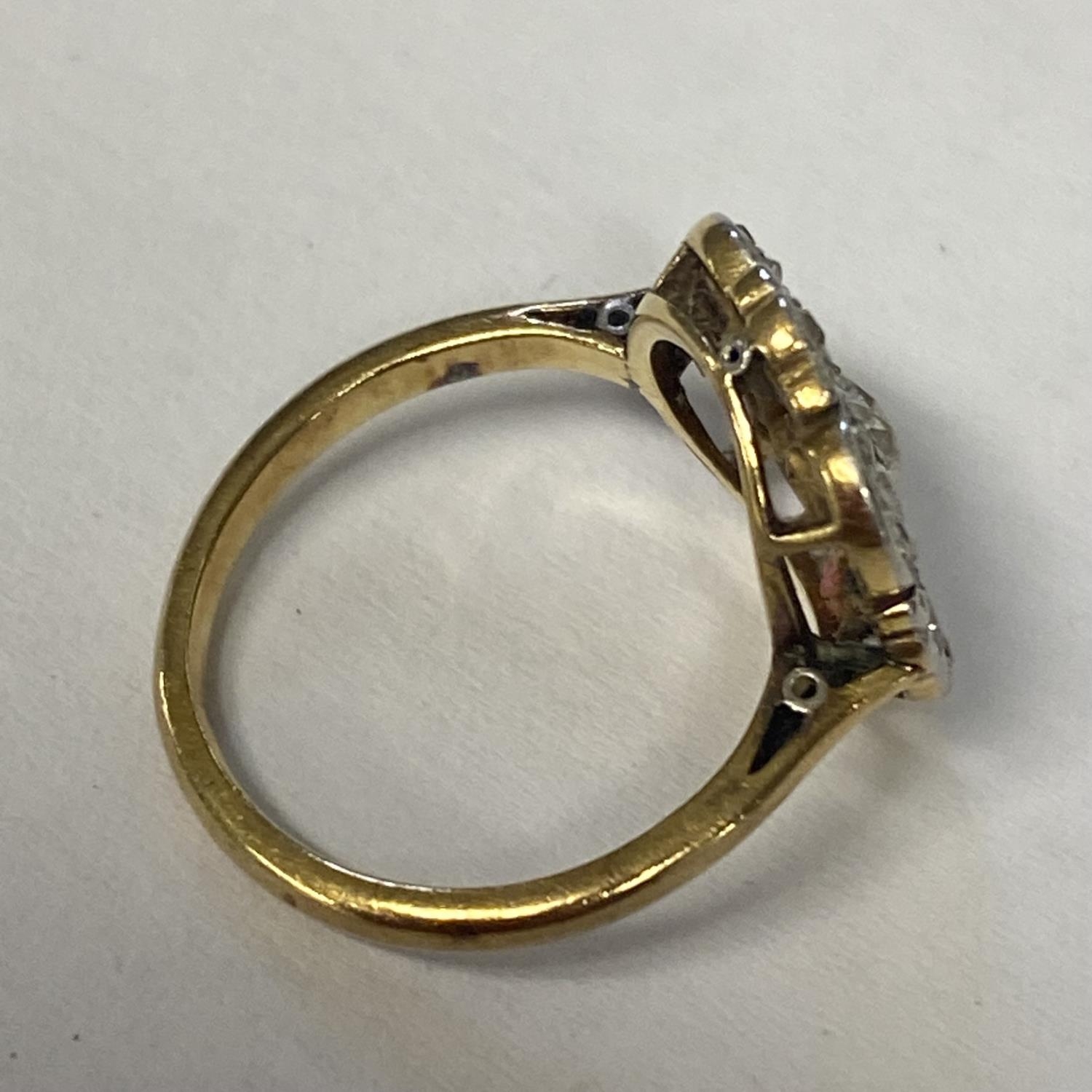 An unmarked white and yellow metal and diamond ring, pierced design with central old cut diamond - Image 2 of 2