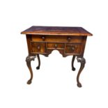 A modern lowboy in richly coloured woods, and profuse cabriole legs 84cm W x 52cm D x 84cm H
