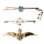 Three 9ct gold lapel brooches and an RAF Sweetheart example, with two aquamarine set bar brooches,