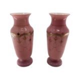 Pair of early C20th pink vases with gilt decoration and circular foot 30c,