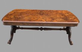 A Victorian Burr Walnut low table or Coffee Table with extensive carvings to legs, Width 132 cm,
