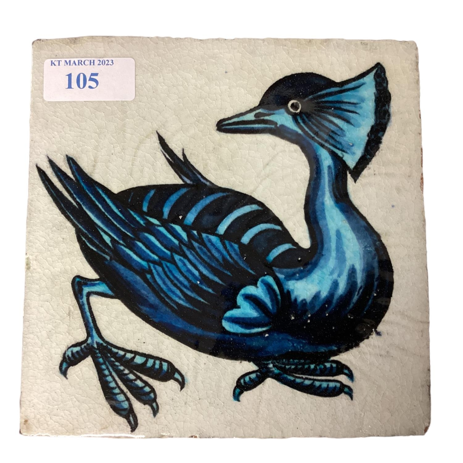 WILLIAM DE MORGAN, A blue and white tile of a stylised bird, stamped verso W DE MORGAN, 15.5 x