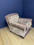 ANDREW MARTIN Large buttoned back armchair, upholstered in a velvet style mauve coloured designer