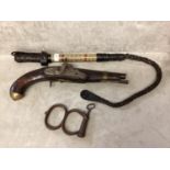 Camel whip and a Tower percussion cap pistol, with chased lock, and brass pommell, and a pair of