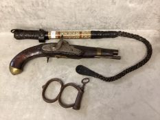 Camel whip and a Tower percussion cap pistol, with chased lock, and brass pommell, and a pair of
