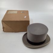 A grey top hat by Lock and CO, St James St London, in box