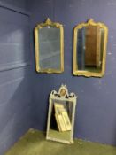 Pair of gilt framed wall mirrors with scrolling borders and finial, and another mirror with grey