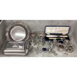 A collection of silver plated items, candlesticks, pierced dish etc