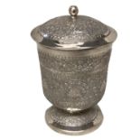 A South Asian white metal lidded cup circular foot with chased decoration with gilt interior,