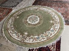 Large Chinese style green ground rug 275cm diameter, a pair of pink rugs 180cm x 120cm, pair of blue