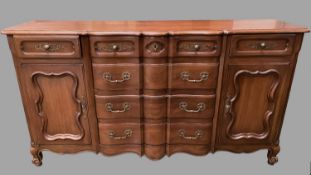 A Fruitwood Sideboard With Four Central Drawers (one for silver), two smallers drawers and