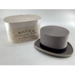 A grey top hat retailed by Bates, Jermyn Street in original box