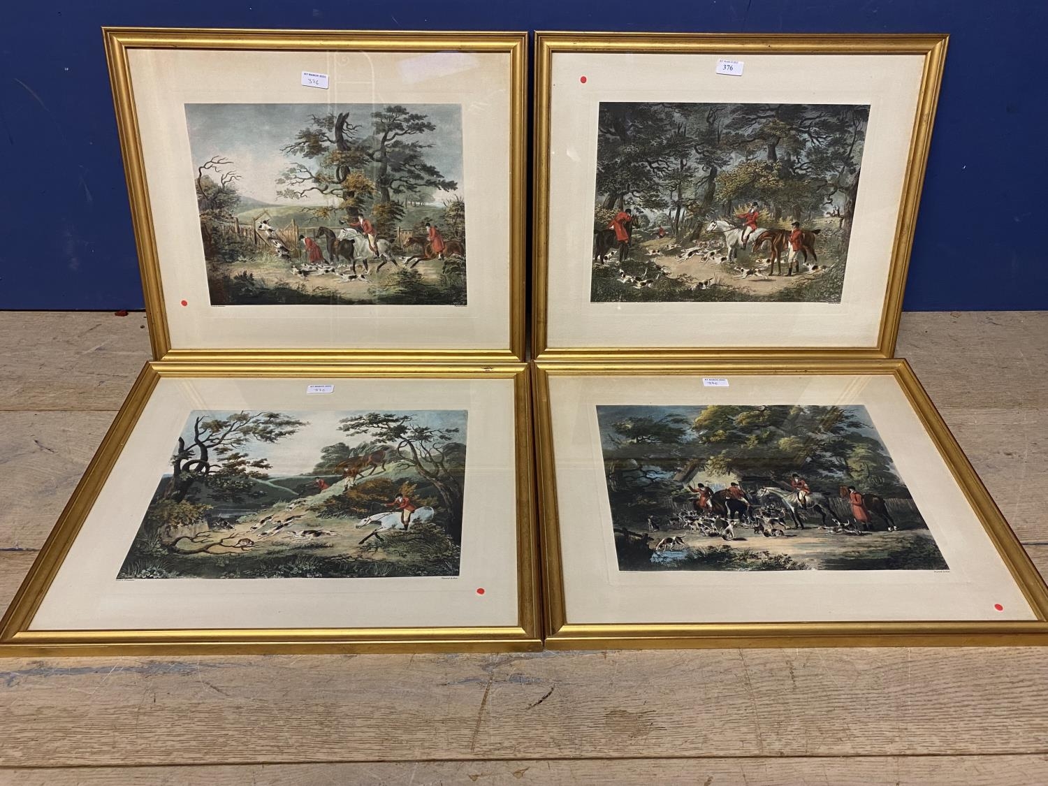 A set of four etching style hunting prints in gilt glazed frames