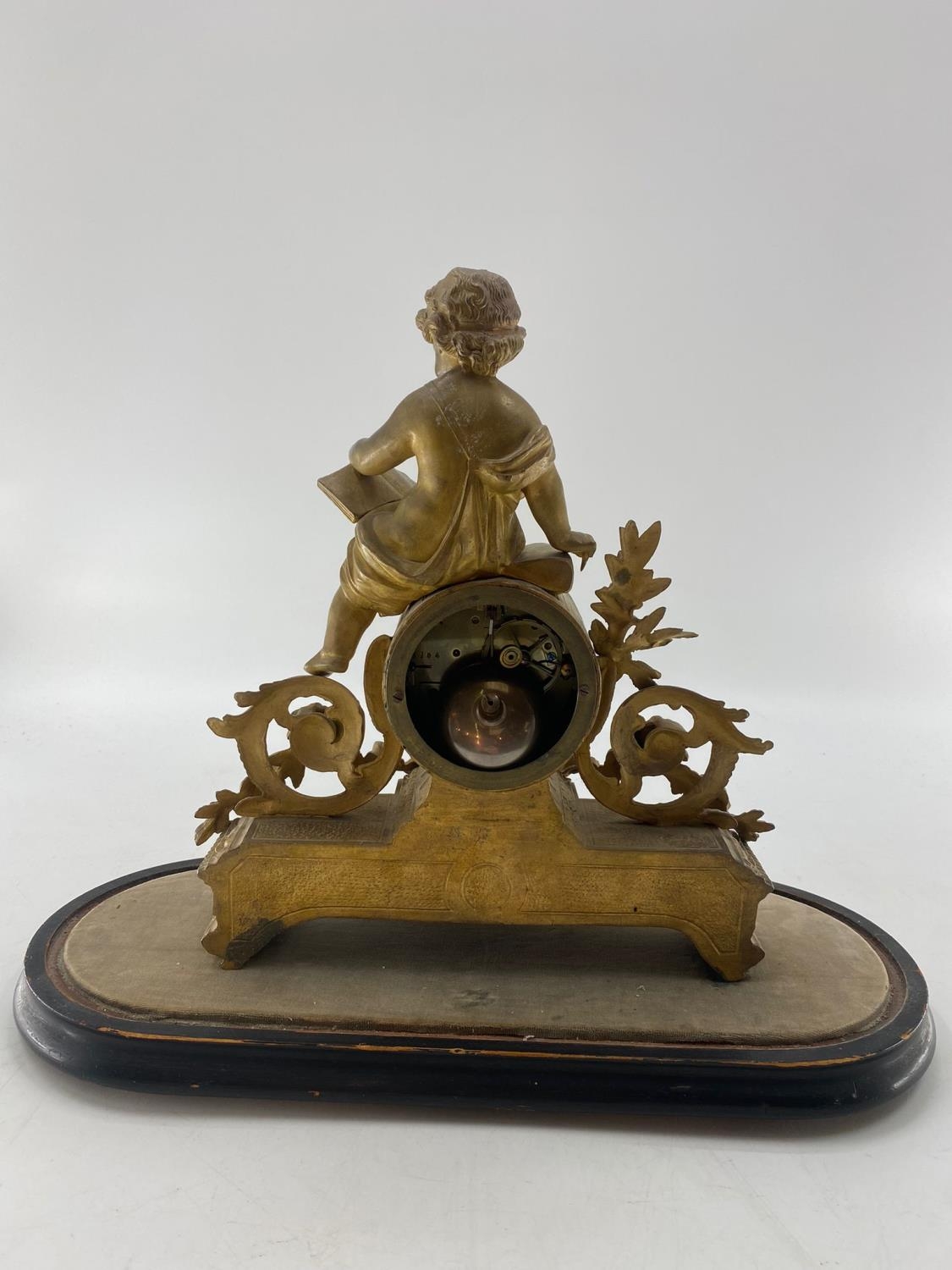 French gilt mantle clock, surmounted by Cherbub figure reading a book, in a glass dome - Image 5 of 5