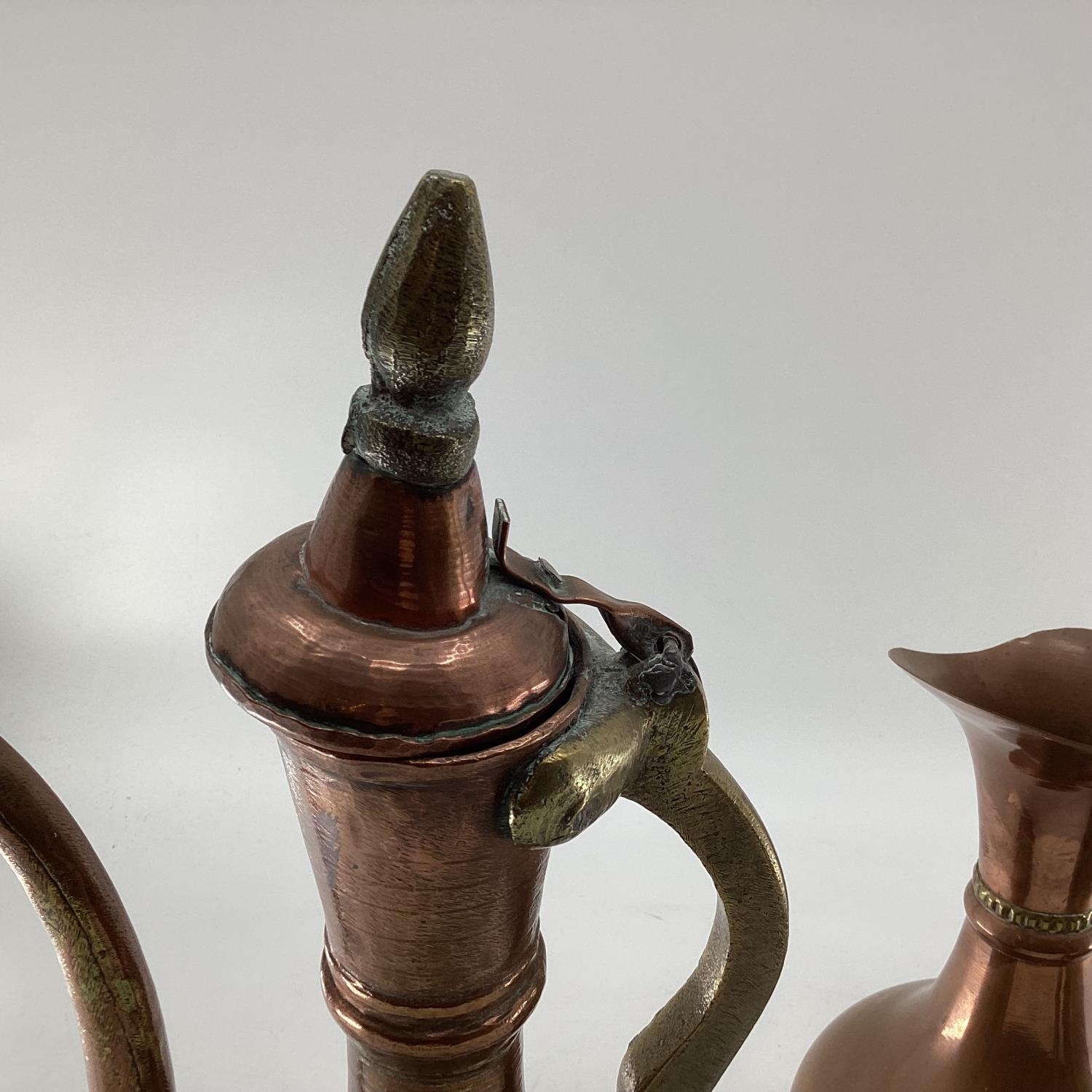 A collection of metalware to include Middle Eastern style ewers, trench art and other items - Image 13 of 15