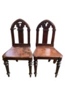 Pair of C19th gothic revival oak hall chairs with arc