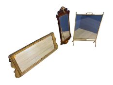A glass and brass fire screen, and a gilt framed long overmantel mirror, and another mahogany framed