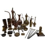 A collection of metalware to include Middle Eastern style ewers, trench art and other items