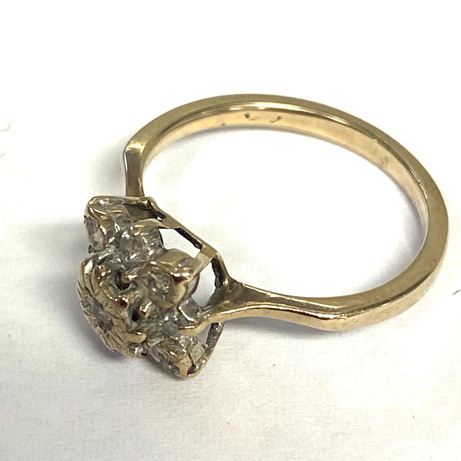 An unmarked (rubbed) yellow and white metal diamond set flower ring, size L - Image 3 of 6