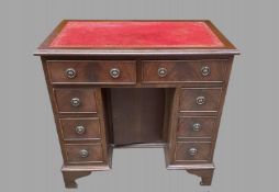 A Ladies Kneehole Desk with Red leather Top Width 80 , Depth 50 and Height 76 cm