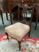 A Victorian small chair, with overstuffed upholstered seat, and cabriole legs to castors