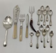 A collection of unmarked white metal and silver plated items to include fish sauce pickle fork etc